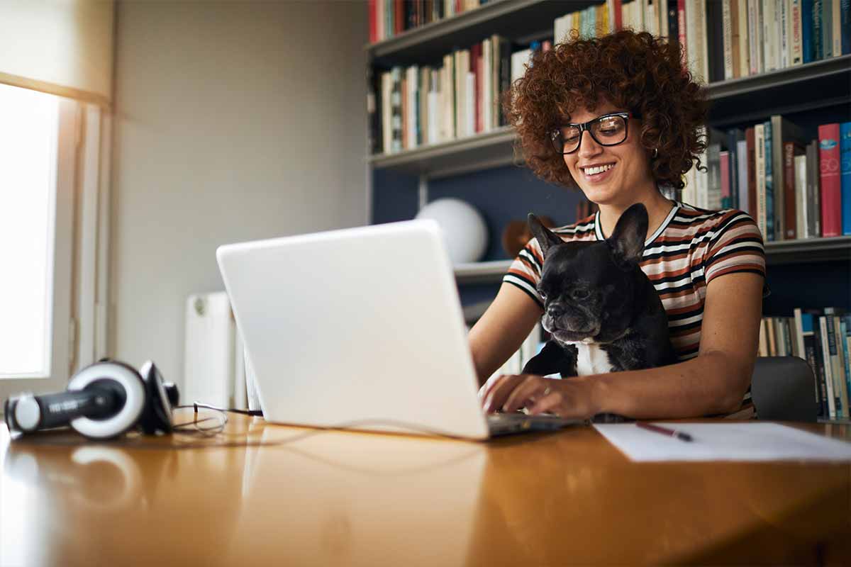 Women at home with a dog